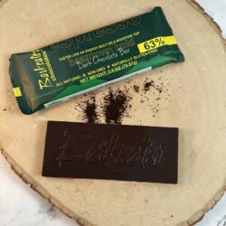 unwrapped dark chocolate bar and wrapped chocolate bar with coffee grounds