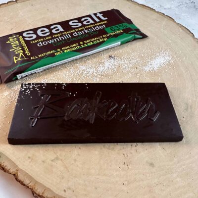 unwrapped dark chocolate bar with sea salt