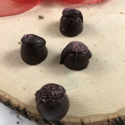 Raspberry Truffles on Wood Slab