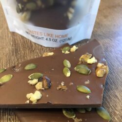 unpackaged milk chocolate bark with walnuts, pumpkin seeds and spices