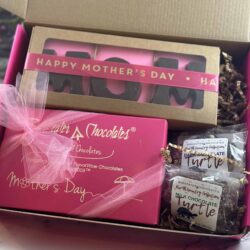 open gift box with assorted chocolates for mother's day