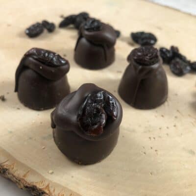 loose dark chocolate cherry truffles on wood