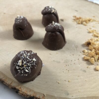 loose hazelnut truffles on a table