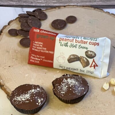 Loose and packaged peanut butter cups on a wood slab